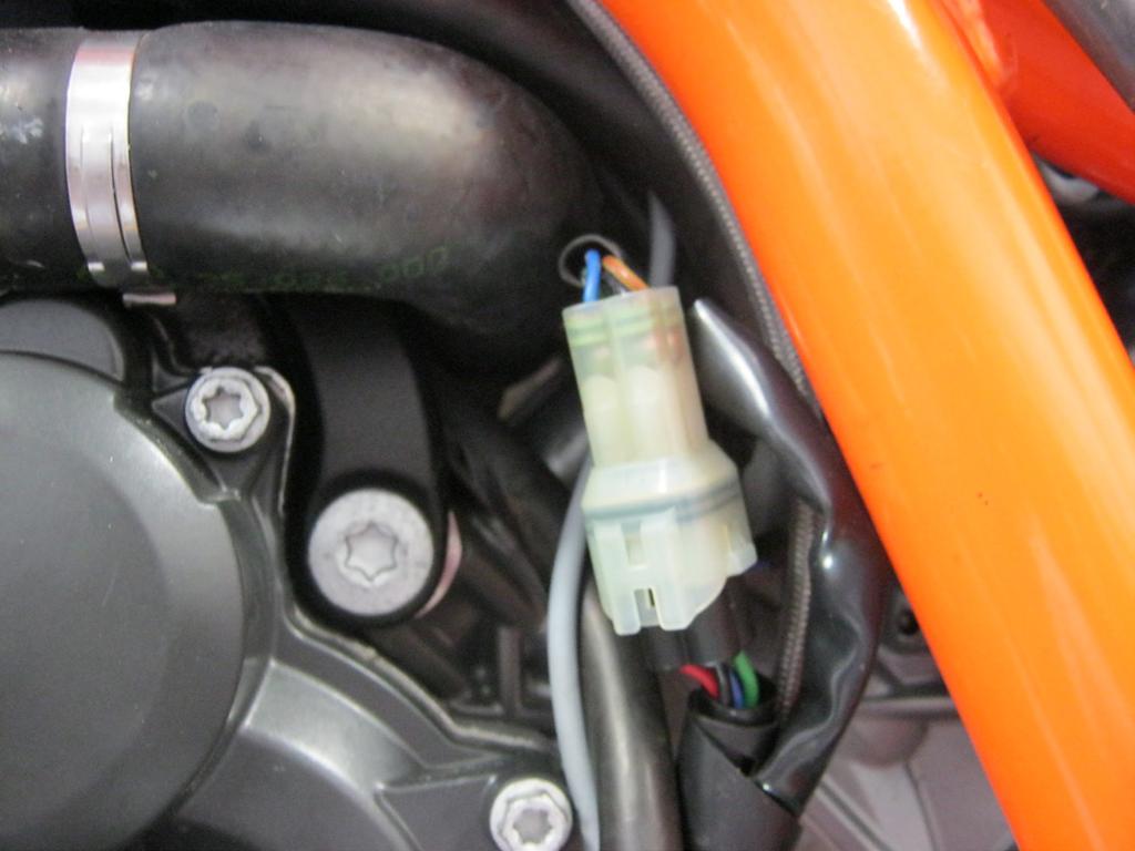 Continue to route this portion of the harness toward the rear of the air box inside the frame.