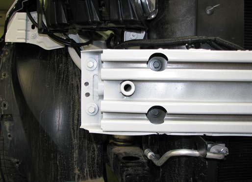 Using a 13MM socket, remove the four bolts (white arrows). Bolts and bumper will not be reinstalled. 11.