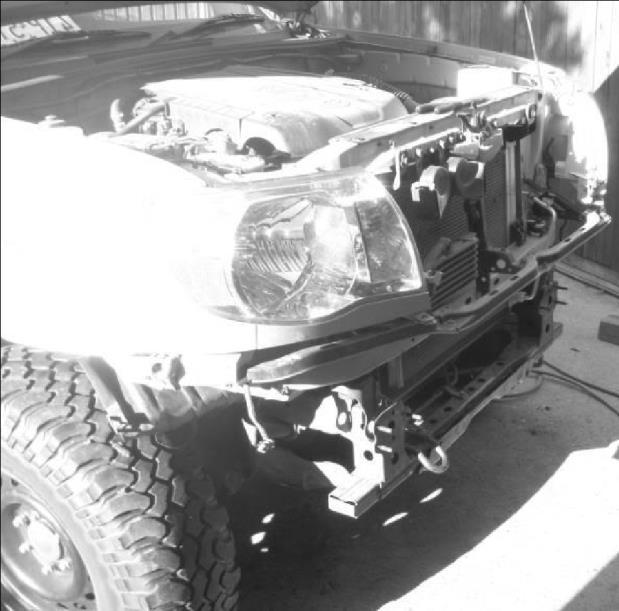 After OEM front bumper and aluminum crash bar removal. The front of your Tacoma should look like picture at left.