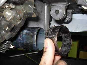 3) Remove three mounting bolts from the stock muffler box 1 One is on right hand side at the
