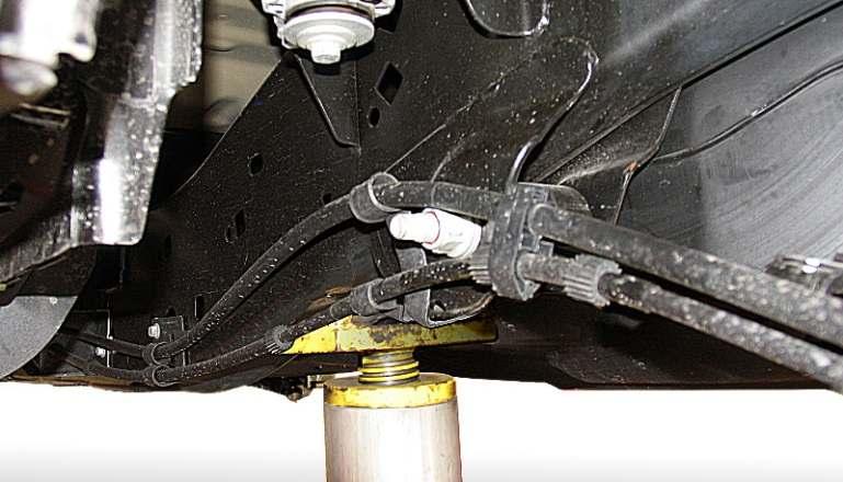 NOTE: If full torque cannot be achieved with vehicle at ride height, tighten cam bolts as much as possible on ground to lock bushing and alignment in place, then raise front of vehicle onto jack