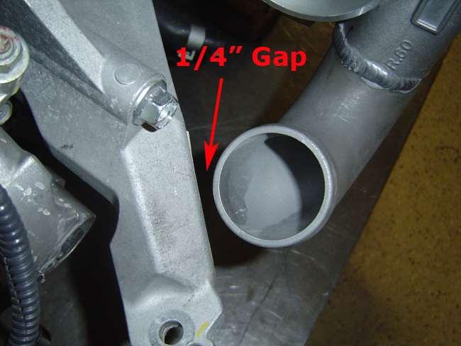 7. Install coolant line #1 as shown below; it faces downward at about a 45 angle towards the front of the engine. Final tighten this line and then the turbo can be final installed on the motor.