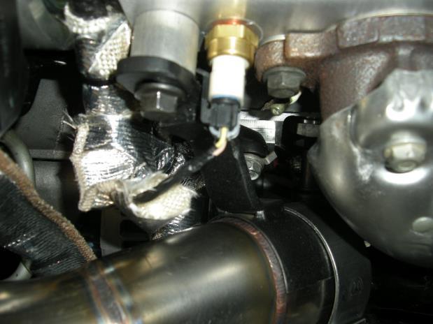 Remove the bolt from the engine behind the alternator (has small ground wire) and attach cat to turbo #2-3 bracket (22140) using the