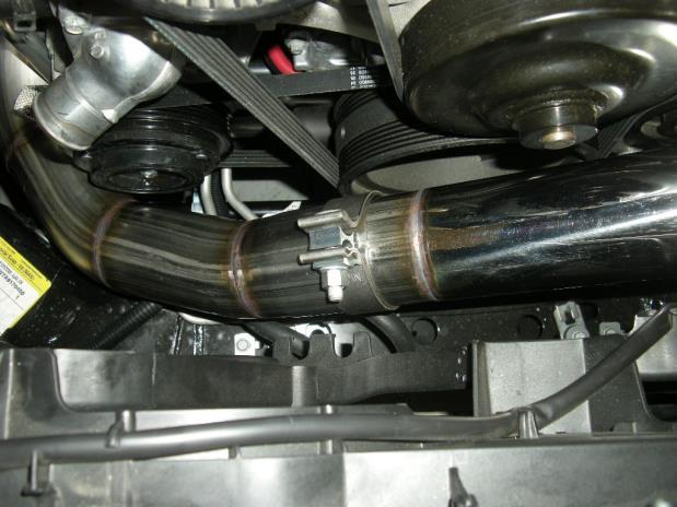 location where the upper radiator hose teed off to the bottom of the