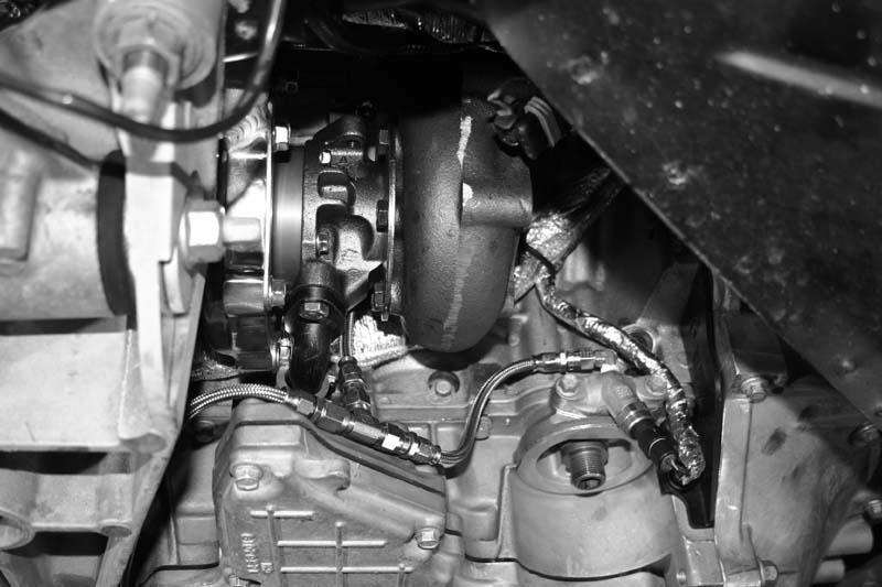 Now is a good time to wrap all wiring etc as shown with heat shielding to prevent damage from the heat of the turbochargers and down pipes. Locate exhaust down pipes and heat wrap and 4 #36 clamps.
