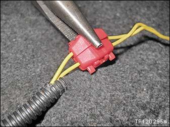 Use pliers to securely attach the shorting pin to the