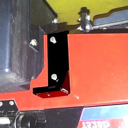 cab. Take the cab lift brackets provided, and bolt onto cab frame through hole provided in upper A-C crossmember, right