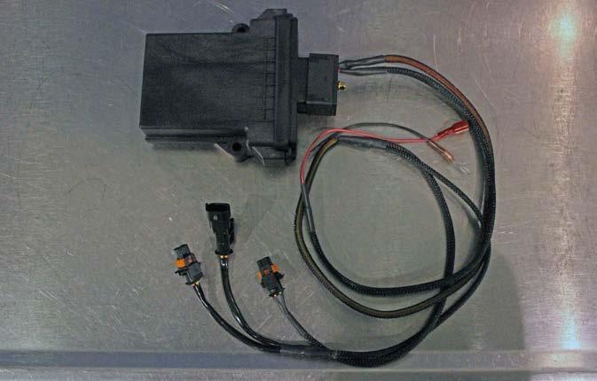 Locate the supplied dual pump control module and harness.