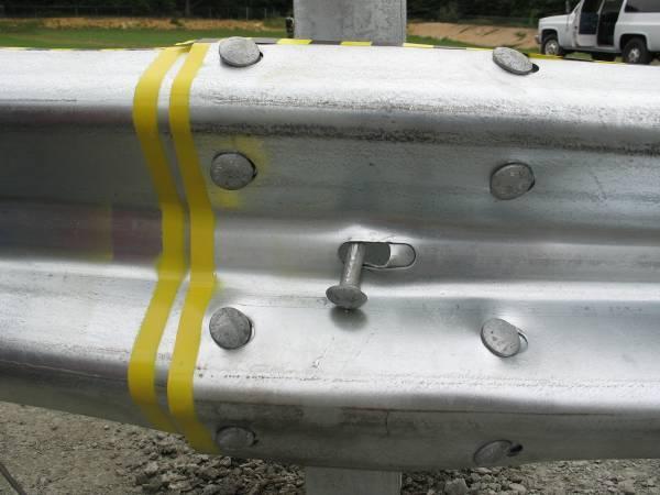 The bolt at the splice location fractured in the threaded region, allowing the rail section to fall to the group after the splice failed.