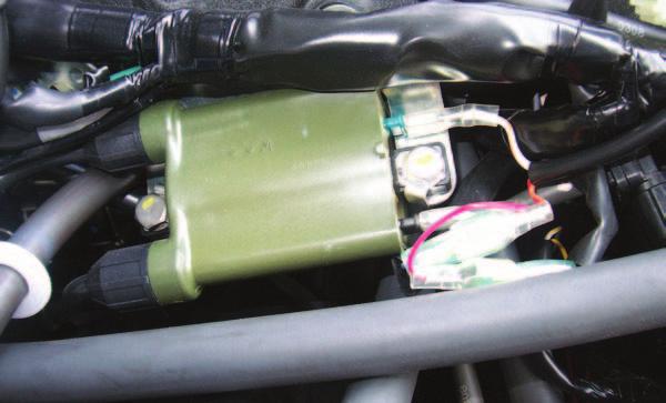 FIG.G 15 Locate the left ignition coil (Fig. G). 16 the BLACK/WHITE wire from the left ignition coil. The BLACK/WHITE wire is connected to the BLACK (lower) pin of the coil.