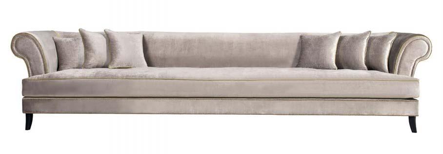 12/0665 Curved Sofa with deep buttoning and piping detail.