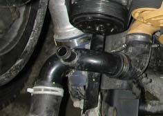 Remove the 1/2 inch NPT OEM plug from the thermostat housing and install the supplied 1/2 NPT 3/4 inch hose barb fitting using Loctite PST sealant, (Figure 1.15). 24 Figure 1.