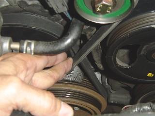 proper alignment. Use a 12 straight rule or other straight device to check the alignment with the power steering pulley as shown in Photo 15.