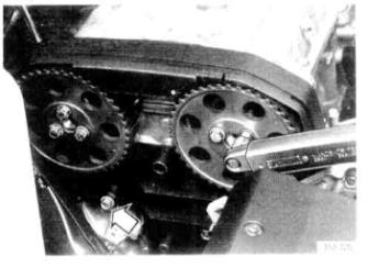 Install camshaft pulleys - Position the upper timing cover - Install camshaft pulleys, align according to marking. - Tighten the two screws until they just come into contact with the camshaft pulleys.