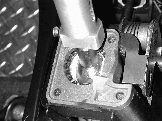 STEP 6: Insert the Ford Racing shifter into the shifter base. Reconnect the lower cable bushing to the bottom of the shifter.