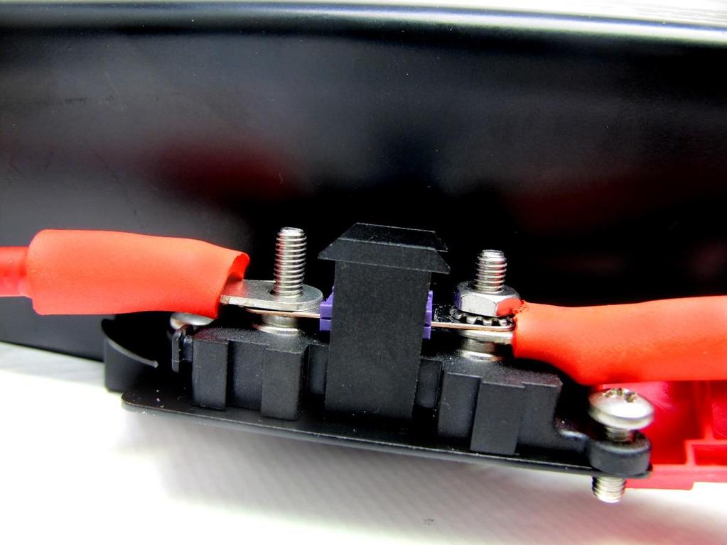 Step 28: Slide the power cable s eyelet over the post on the fuse holder