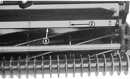 ADJUSTING THE TOP BAR Adjust the top bar to assure clippings are cleanly discharged from reel area: 1. Loosen screws securing the top bar (Fig. 5). Insert a 0.