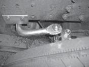 The front of the bracket must touch the back of the trailing arm bracket. The bracket must be against the bottom of the frame rail.