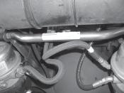 Lubricate the inside of the split bushings and install them on the antisway bar near the arms.