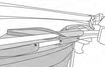 Catch the hook in the loop in the windshield frame and then close the lever over it so that it lays fl at