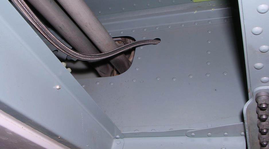 9 Routing under Airframe Cut and install grommet edging in this area to prevent chafing of hydraulic hose. Route the hose up through the rear cabin bulkhead as shown in Figure 2.