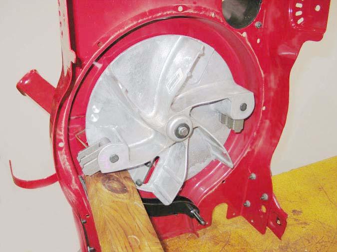 4.11. Block the impeller with a chock, to keep it from rotating. Using a 9/16 socket, remove the bolt, lock washer, and flat washer securing the impeller to the crankshaft. See Figure 4.11. Bolt Impeller 4.