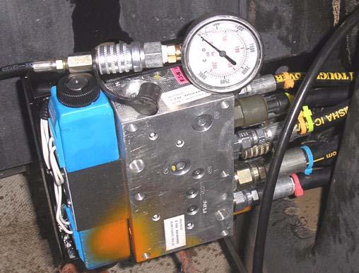 Adjusting the AutoFarm Relief Valve 1. Install a 5000 psi pressure gauge on the AutoFarm valve diagnostics port labeled GP.