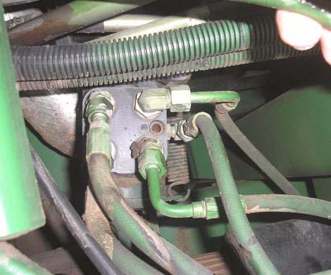 Orbitrol Tank Hose Connection 3. Identify the Tank hose on the steering unit (Orbitrol) as shown in Figure 2-17. 4.
