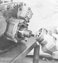 The two countershaft drive gears will mesh with the auxiliary drive gear, and front of countershaft will seat in the two bearing installed in the front section.