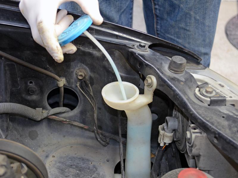 If the fluid level appears to be low, refill the reservoir with window washer fluid.