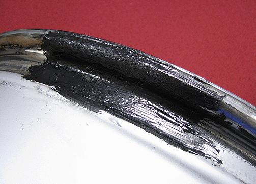 Commercially available bead sealants are black rubber-like coatings that will permanently fill and seal the resurfaced bead seat.