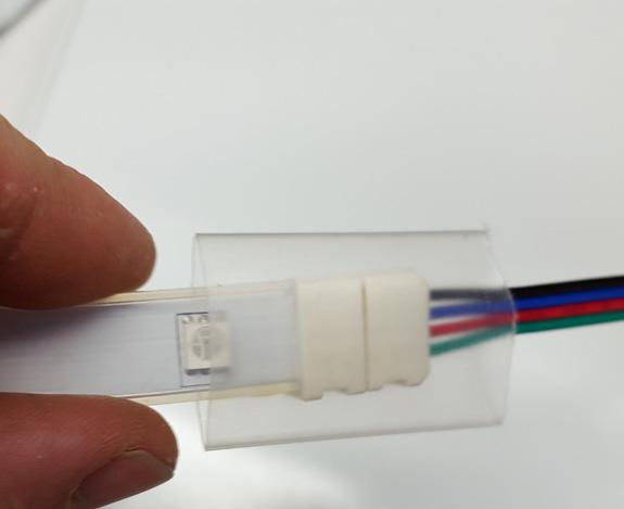 (Note: The above picture shows the connector attached INCORRECTLY) 3 4 5 6 Close the white section of the strip to