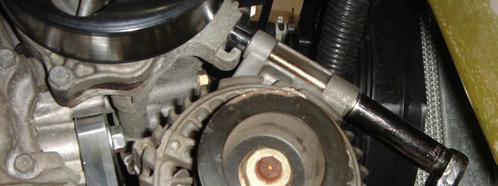 Once you get the upper bolt started, it will be able to support the alternator such that you can now start the