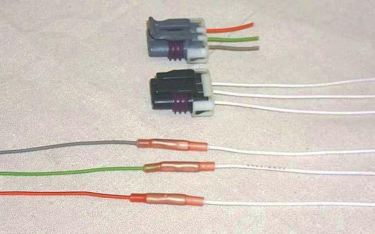 128. Install the new MAP harness to the orange/ black, green and gray wires using the crimp/ shrink connectors supplied.