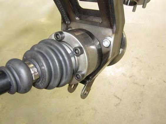 Raise the lower control arm and outer upright until the CV joint axle