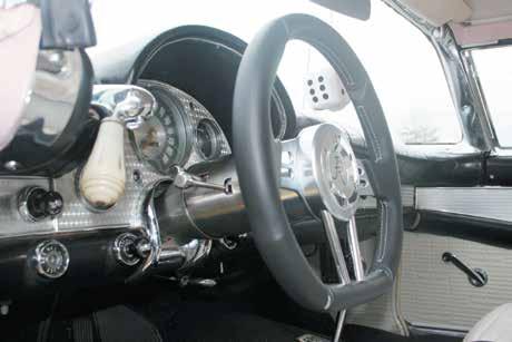 6) Place horn button retaining ring, flange facing down, through center hole of steering wheel.