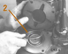 Do not install the countershaft rear bearing cover gasket. Position the rear bearing cover over the shim.