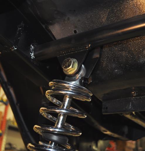 8. Attach the machined studs to the rear lower trailing arm brackets and mount the coil over shocks to the studs.