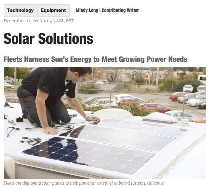Solar panels installed on the tops of truck cabs and trailers are generating energy for a