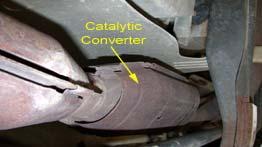 Catalytic Converter In a catalytic converter, the catalyst (in the form of platinum and palladium) is coated onto a ceramic honeycomb or ceramic beads that are housed in a mufflerlike package