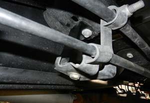 Slightly loosen but do not remove the driver side u-bolts. Remove the passenger side u-bolts completely and discard.