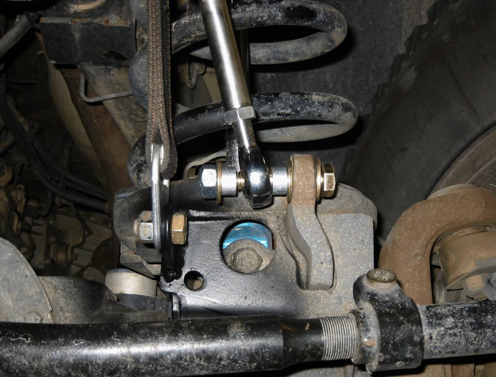 Note: For easier installation, separate right side tie rod end from knuckle.