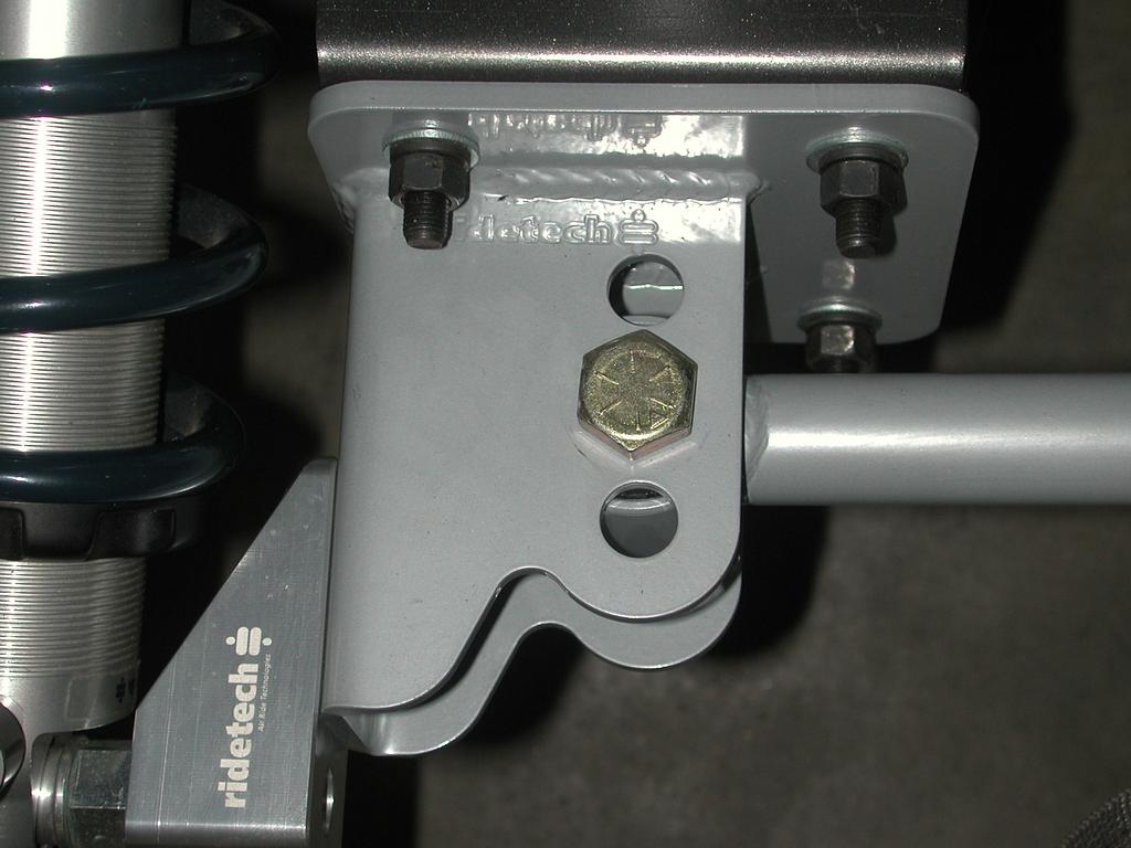 4. The two forward tabs grab the pinch weld and have a backer plate on the inside of the car under the back seat. These are attached using (6) 3/8 x 1 ¼ bolts washers and Nylok nuts. 5.