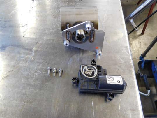 Rotate the assembly so that the actuator motor is vertical and until the