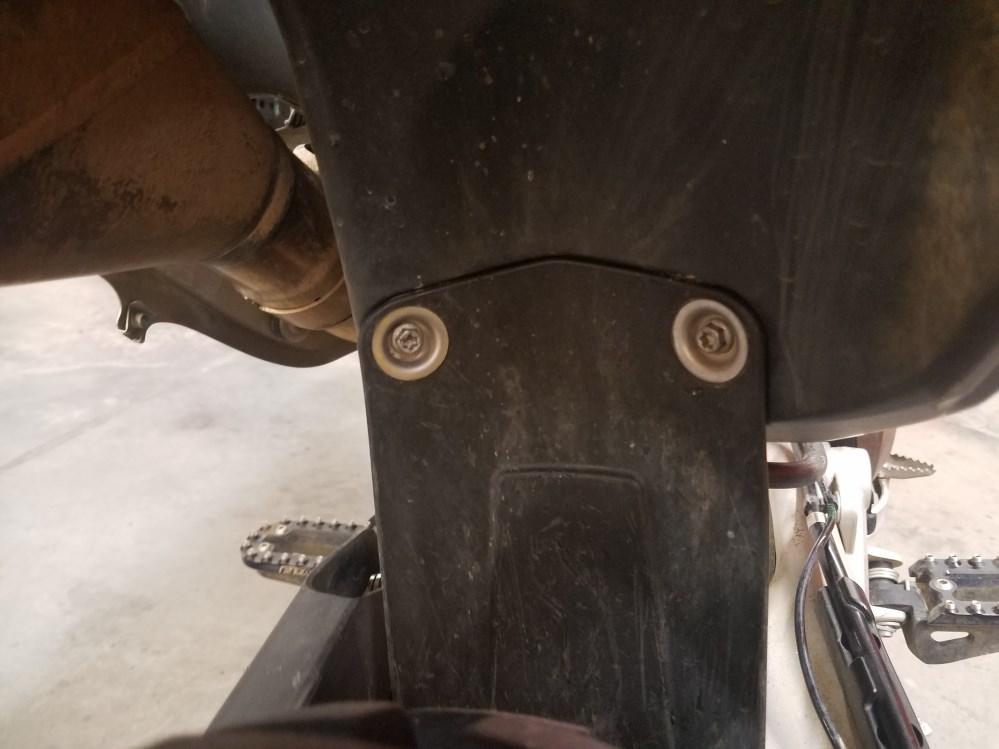 Remove the four M5 screws that connect the fuel pump housing to the bottom of the