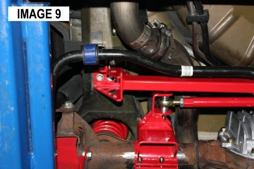 There are two ways to proceed: Either lower the cross-brace to attach the Watts Link or remove the springs so you can compress the axle upwards to make clearance for the installation. 15.