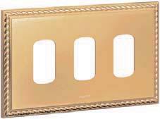66-67) Front plate : clip on electroplated polished die cast plate with electrophoretic applied gloss brass lacquer; anthracite interiors; matching decorative rockers (except where indicated) Pack
