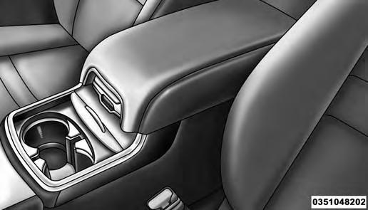 Two separate storage compartments are also located underneath the center console armrest.