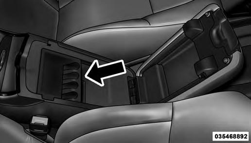 Inside the center console armrest, there is a removable upper storage tray that can be slid forward/rearward on rails for access to the lower storage area.