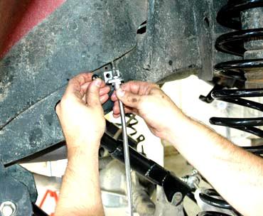 Install on the caliper with stock caliper bolt and brake line washers using a 14mm socket.